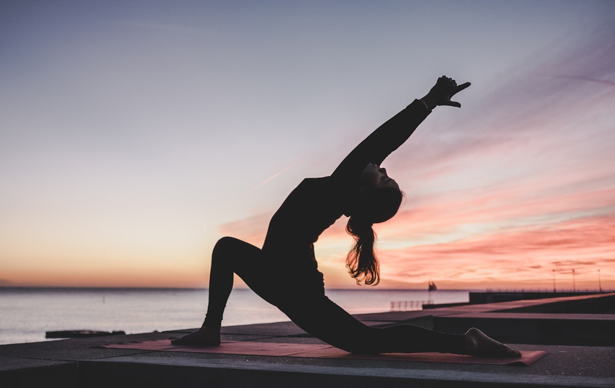 Person exercising outdoors in morning light